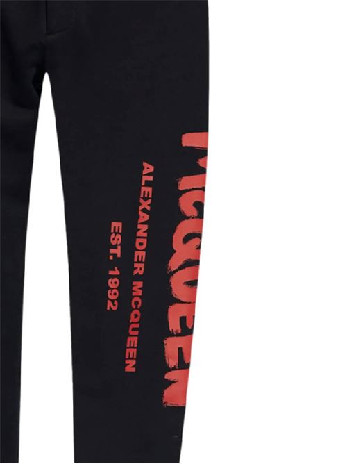 Pantaloni in jersey di cotone nero/rosso stampa logo ALEXANDER MCQUEEN | 688714QTAAB0509